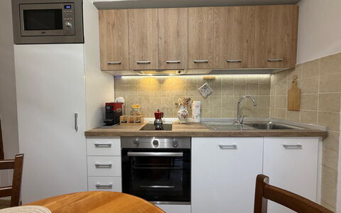 Casa di Mario: Kitchen Appliance, Kitchen, Countertop, Cabinetry, Major Appliance, Furniture, Wood, Interior Design, Flooring, Home Appliance