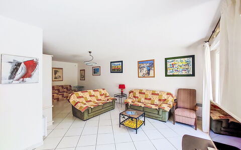 Virginie: Furniture, Couch, Interior Design, Apartment, Flooring, Floor, Room, Living Room, Picture Frame