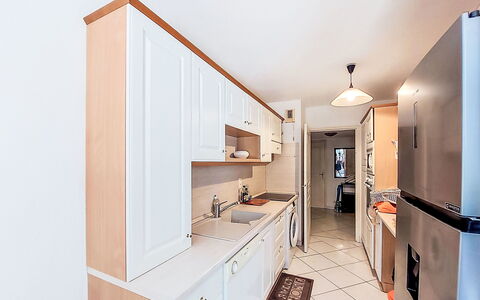 Virginie: Countertop, Kitchen, Interior Design, Cabinetry, Flooring, Furniture, Major Appliance, Kitchen Appliance, Wood, Floor