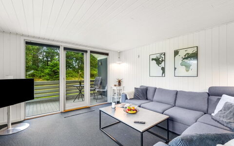 Hubert - 450M to the Fjord: Couch, Furniture, Living Room, Hardwood, Coffee Table, Chair, Wood Flooring, Houseplant, Plank