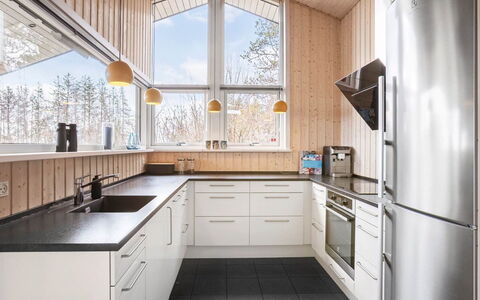Chris - 130M from the Sea: Kitchen, Countertop, Kitchen Appliance, Wood, Interior Design, Major Appliance, Cabinetry, Ceiling, Light Fixture, Kitchen Sink