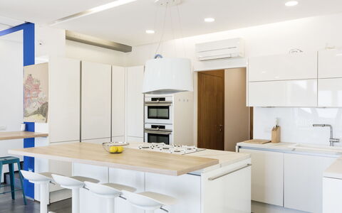 Capri: Furniture, Interior Design, Flooring, Kitchen, Floor, Wood, Countertop, Ceiling, Light Fixture, Cabinetry