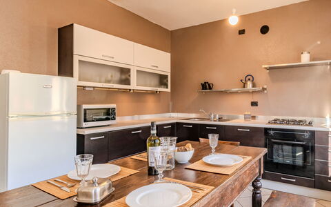 Barella: Furniture, Interior Design, Flooring, Kitchen, Wood, Countertop, Cabinetry, Ceiling, Kitchen Appliance, Floor