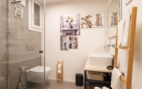 Kuerc Design Mountain Home: Interior Design, Flooring, Wall, Floor, Plumbing Fixture, Bathroom, Wood, Toilet, Ceiling, Lighting