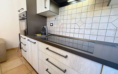 Alpamar: Kitchen, Countertop, Flooring, Kitchen Stove, Floor, Interior Design, Kitchen Appliance, Tile, Major Appliance, Cabinetry