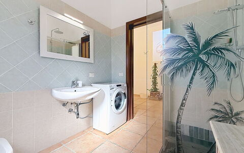Alpamar: Flooring, Floor, Interior Design, Plumbing Fixture, Wall, Ceiling, Bathroom, Room, Lighting, Washing Machine