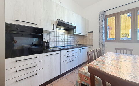 Alpamar: Kitchen, Countertop, Flooring, Kitchen Appliance, Major Appliance, Interior Design, Cabinetry, Floor, Room, Home