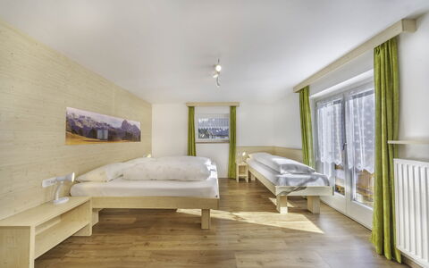 Chalet Dumbria Dolomites: Bedroom, Hardwood, Wood Stain, Bed, Bed Frame, Hotel, Glacial Landform, Wood Flooring, Bedding, Alps