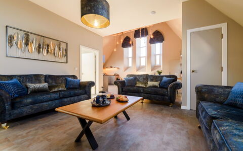 Towan Beach: Furniture, Couch, Wood, Interior Design, Living Room, Home, Flooring, Floor, Lighting, Apartment
