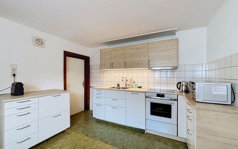 Ferienhaus Christl: Flooring, Kitchen, Cabinetry, Interior Design, Floor, Countertop, Kitchen Appliance, Furniture, Room, Ceiling