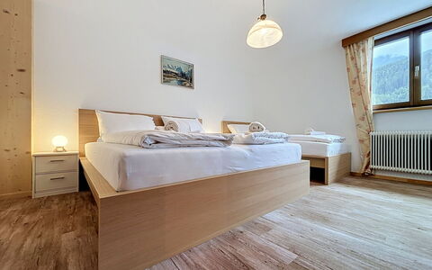 Ferienhaus Christl: Bed, Bedroom, Bed Sheet, Interior Design, Wood, Bedding, Floor, Flooring, Ceiling, Room