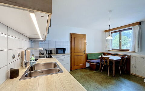 Ferienhaus Christl: Ceiling, Interior Design, Flooring, Room, Floor, Cabinetry, Hardwood, Light Fixture, Wood Stain, Chair