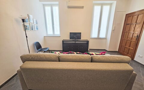 Due Passi: Furniture, Interior Design, Flooring, Couch, Floor, Wood, Room, Living Room, Lighting, Apartment