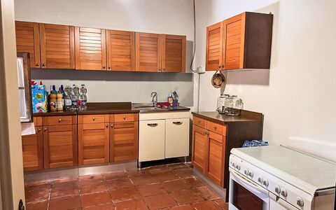 Villa Monti: Cabinetry, Kitchen, Flooring, Countertop, Kitchen Appliance, Furniture, Wood, Major Appliance, Drawer, Floor