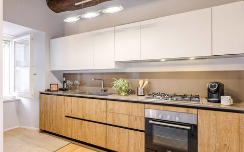 La Casa in Centro: Kitchen, Countertop, Interior Design, Cabinetry, Furniture, Kitchen Appliance, Wood, Flooring, Major Appliance, Home Appliance