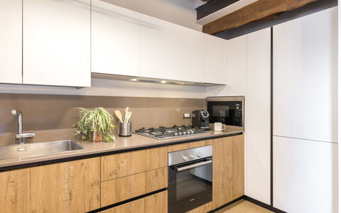 La Casa in Centro: Kitchen, Countertop, Interior Design, Wood, Flooring, Cabinetry, Furniture, Kitchen Appliance, Floor, Major Appliance