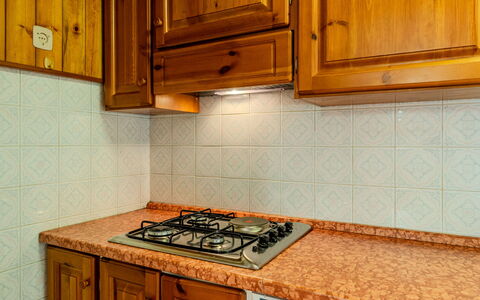 Calvet: Kitchen, Wood, Major Appliance, Flooring, Countertop, Kitchen Appliance, Cabinetry, Stove, Kitchen Sink, Kitchen Stove