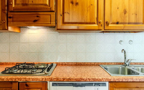 Calvet: Kitchen, Countertop, Kitchen Appliance, Major Appliance, Cabinetry, Kitchen Sink, Wood, Flooring, Plumbing Fixture, Interior Design