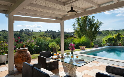 Al Melo: Furniture, Chair, Table, Flowerpot, Interior Design, Outdoor Furniture, Home, Resort, Houseplant, Porch