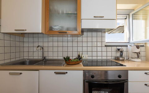 La Certaldina Sole Apartment: Kitchen, Countertop, Kitchen Appliance, Kitchen Sink, Cabinetry, Major Appliance, Interior Design, Plumbing Fixture, Sink, Tap