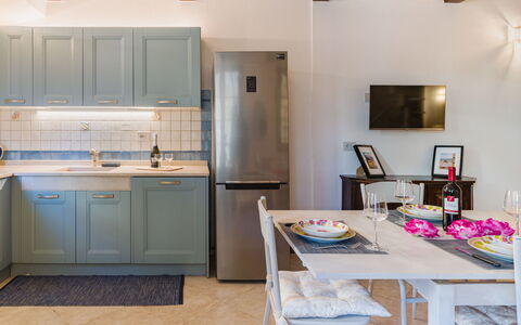 Casa Corallina: Furniture, Kitchen, Kitchen Appliance, Interior Design, Countertop, Major Appliance, Flooring, Wood, Cabinetry, Floor