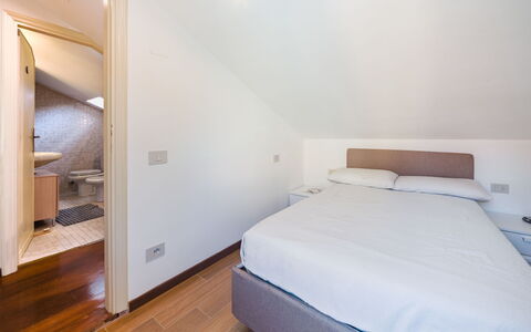 Casa Corallina: Interior Design, Flooring, Floor, Wood, Bed, Bedroom, Ceiling, Furniture, Room, Lighting