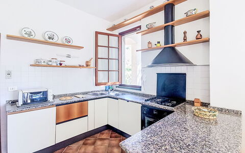 La Villa di Andrea: Kitchen, Flooring, Interior Design, Countertop, Floor, Home, Kitchen Appliance, Cabinetry, Room, Major Appliance