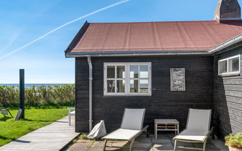 Aaran - 100M from the Sea: Wood, House, Cottage, Roof, Door, Home, Siding, Porch, Plank, Deck