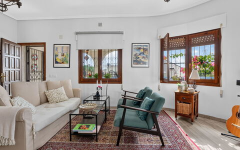 Quesada: Furniture, Interior Design, Flooring, Couch, Table, Floor, Living Room, Ceiling, Chair, Room