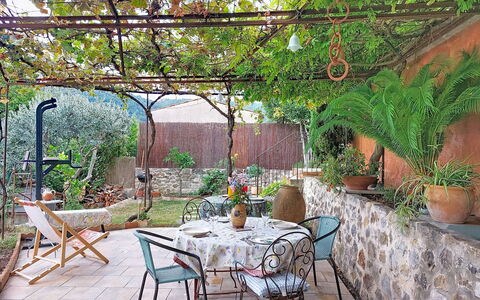 Maison de Village Manolsi: Furniture, Flowerpot, Outdoor Furniture, Table, Garden, Chair, Flagstone, Outdoor Table, Shade