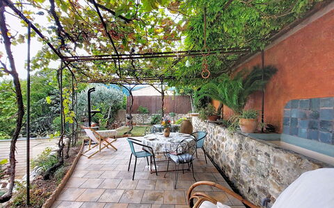 Maison de Village Manolsi: Furniture, Outdoor Furniture, Flowerpot, Flagstone, Chair, Garden, Shade, Outdoor Table, Houseplant