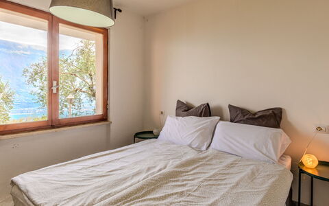 Casa Panoramica: Bed, Bedroom, Wall, Interior Design, Bed Sheet, Bedding, Wood, Furniture, Floor, Room