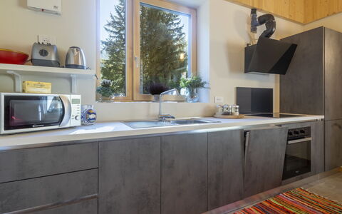 Crestun Design Duplex: Countertop, Kitchen, Kitchen Appliance, Flooring, Furniture, Major Appliance, Wood, Interior Design, Cabinetry, Home Appliance