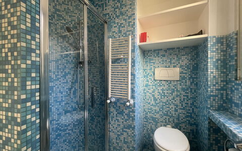Appartamento Chiavari, Roma: Blue, Bathroom, Plumbing Fixture, Flooring, Wall, Interior Design, Floor, Bathroom Sink, Tile, Toilet