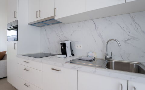De Strandloper i with Parking & Airco: Furniture, Interior Design, Flooring, Ceiling, Floor, Chair, Room, Lighting, Table, Kitchen & Dining Room Table