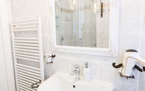 Lagomonti Apartments: Flooring, Bedroom, Bedding, Bed, Bed Frame, Linens, Bed Sheet, Hardwood, Mattress, Wood Flooring