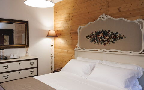 Lagomonti Apartments: Flooring, Bedroom, Bedding, Bed, Bed Frame, Linens, Bed Sheet, Hardwood, Mattress, Wood Flooring