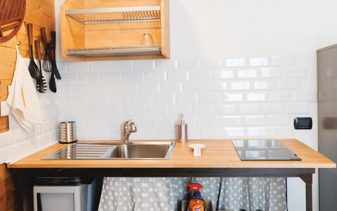 Lagomonti Apartments: Flooring, Bedroom, Bedding, Bed, Bed Frame, Linens, Bed Sheet, Hardwood, Mattress, Wood Flooring