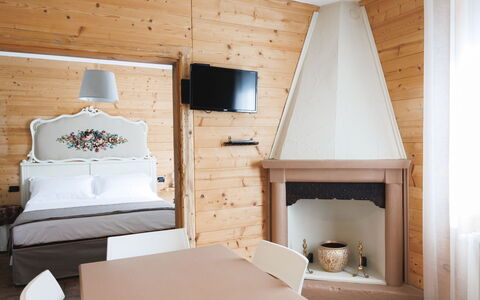 Lagomonti Apartments: Flooring, Bedroom, Bedding, Bed, Bed Frame, Linens, Bed Sheet, Hardwood, Mattress, Wood Flooring