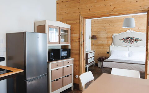 Lagomonti Apartments: Flooring, Bedroom, Bedding, Bed, Bed Frame, Linens, Bed Sheet, Hardwood, Mattress, Wood Flooring