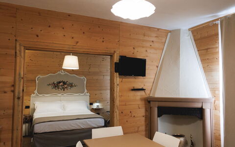 Lagomonti Apartments: Flooring, Bedroom, Bedding, Bed, Bed Frame, Linens, Bed Sheet, Hardwood, Mattress, Wood Flooring
