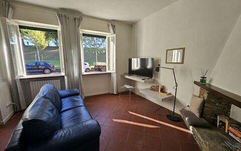 Adele: Flooring, Interior Design, Furniture, Floor, Wood, Ceiling, Room, Lighting, Couch, Living Room