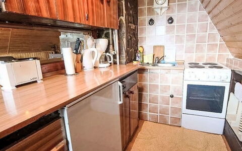 Svahová 1: Wood, Kitchen, Countertop, Major Appliance, Furniture, Flooring, Kitchen Appliance, Kitchen Stove, Cabinetry, Floor