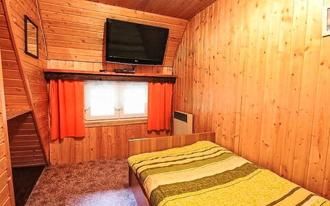 Svahová 1: Wood, Floor, Flooring, Bedroom, Bed, Wood Stain, Interior Design, Room, Ceiling, Home