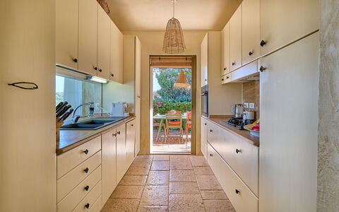 Villa Ananda 8: Countertop, Kitchen, Cabinetry, Kitchen Appliance, Flooring, Interior Design, Furniture, Wood, Major Appliance, Floor