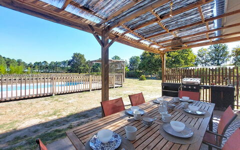 Tartoure: Wood, Shade, Porch, Deck, Cottage, Wood Stain, Hardwood, Fence, Outdoor Structure, Eco Hotel