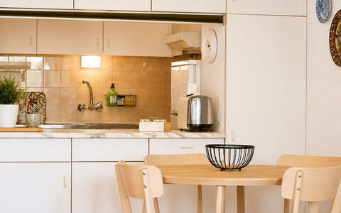 Paloma: Furniture, Kitchen, Interior Design, Countertop, Flooring, Kitchen Appliance, Wood, Cabinetry, Light Fixture, Floor