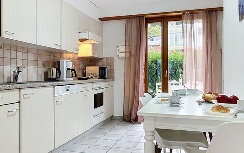 Résidence la Vigne: Furniture, Countertop, Kitchen, Interior Design, Kitchen Appliance, Cabinetry, Flooring, Major Appliance, Chair, Floor