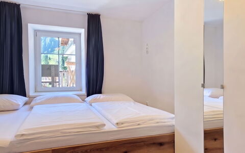 Haus Enzian: Wood, Interior Design, Bedroom, Flooring, Floor, Bed, Furniture, Ceiling, Bed Sheet, Room