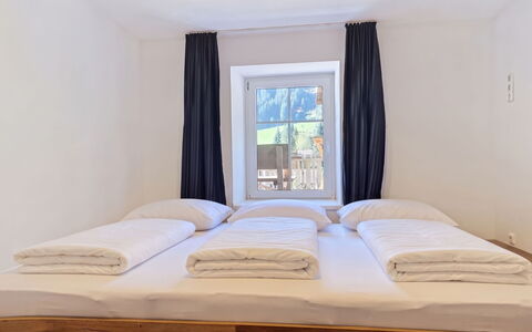 Haus Enzian: Bed, Bedroom, Bedding, Interior Design, Bed Sheet, Floor, Wood, Furniture, Flooring, Room